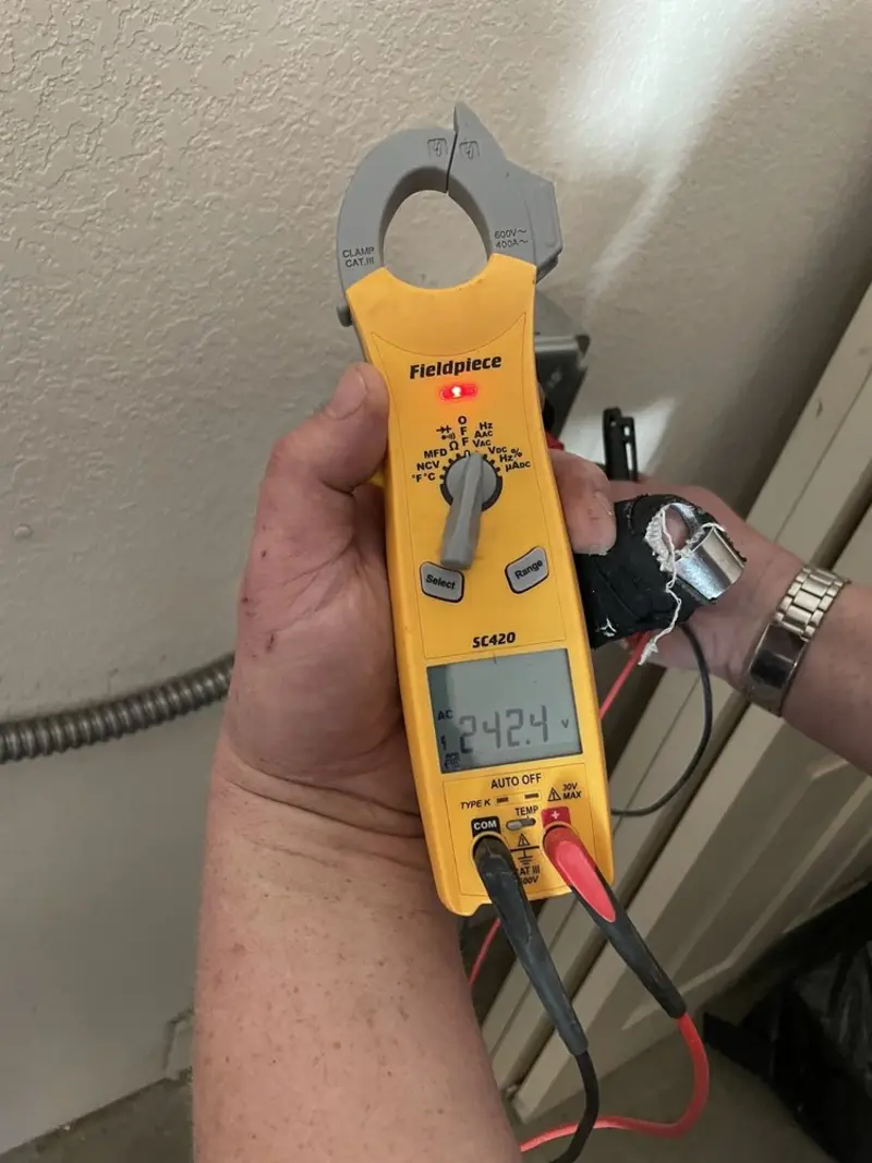 Voltage testing with clamp meter during Outlet Installation in Holmen